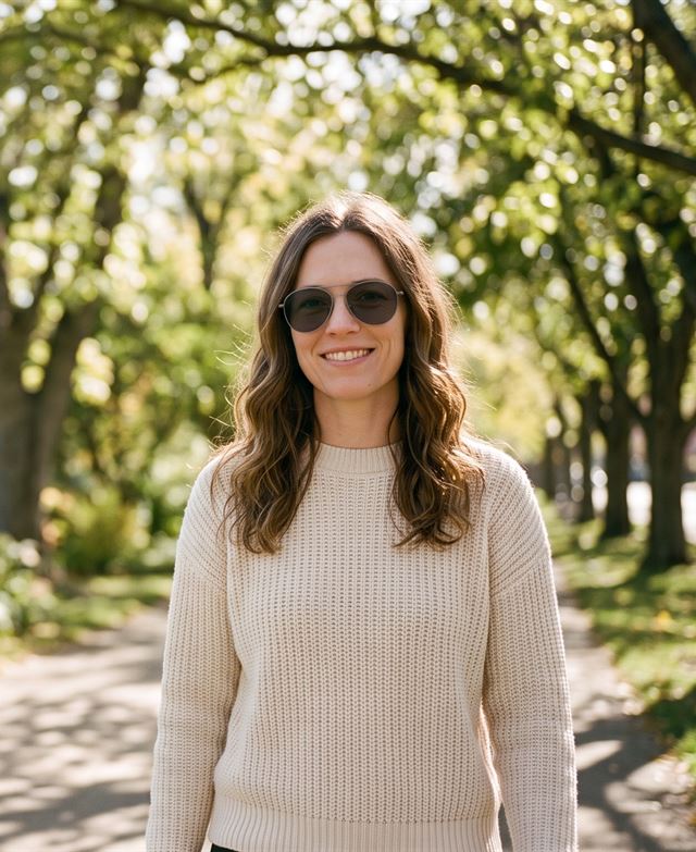 Woman outdoors wearing clear-to-dark lenses darkened by the sun